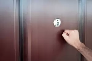 man knocking on apartment door