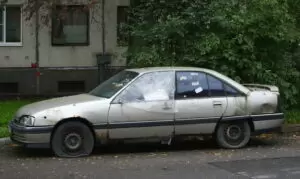 a old abandoned car on the street